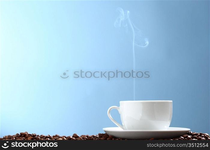 coffee background aroma and beans on blue