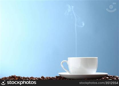 coffee background aroma and beans on blue