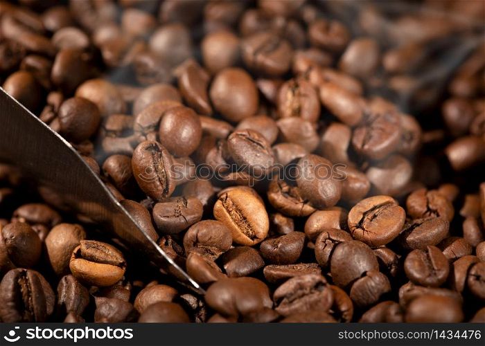 Coffee background. Roasted Coffee beans and scoop
