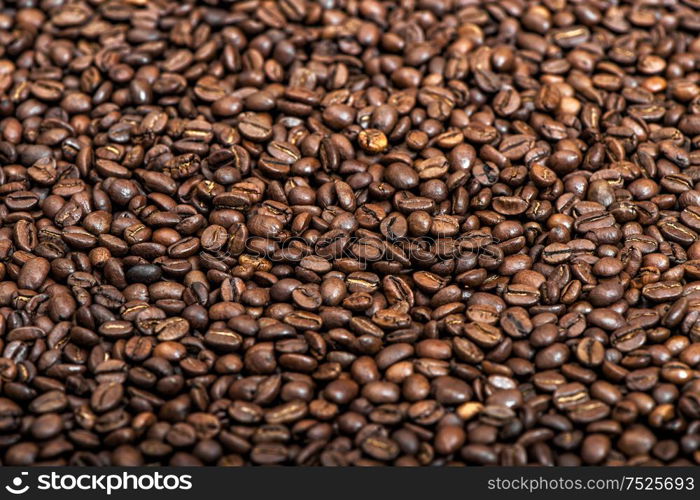 Coffee background texture. Brown coffee beans. Selective focus