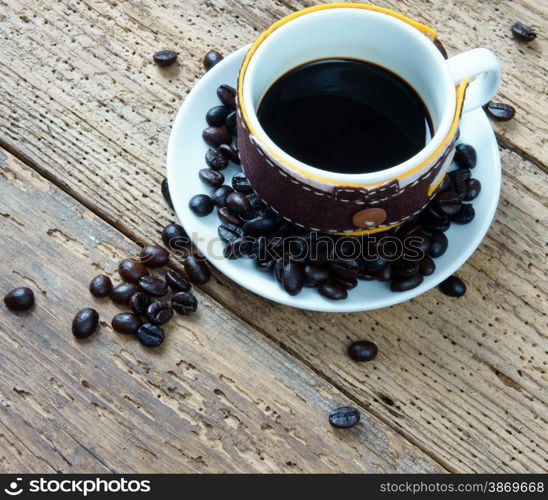 Coffee background with coffee cup, coffee bean on wooden background, beautiful and amazing concept, cafe is drinking that rich caffeine, stimulate to sense, mind