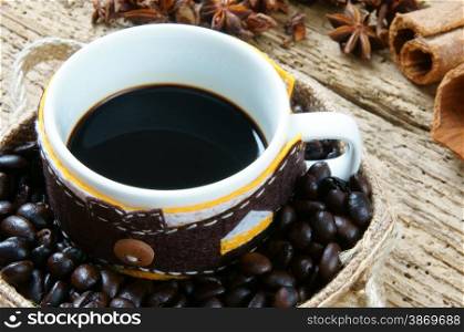 Coffee background with coffee cup, coffee bean on wooden background, beautiful and amazing concept, cafe is drinking that rich caffeine, stimulate to sense, mind
