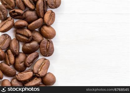 Coffee bean border on painted wood surface