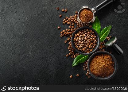 Coffee beans and coffee powder with tamper on dark background. Coffee concept. Coffee background. Flat Lay.