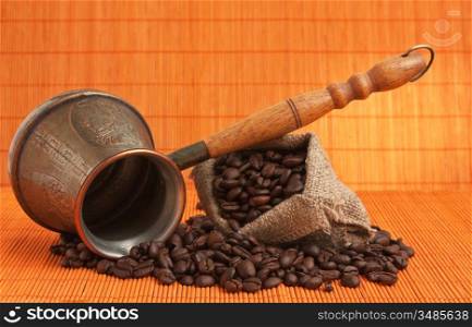 coffee beans and copper coffee maker
