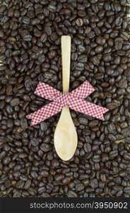 Coffee beans and decorated wooden spoon&#xA;