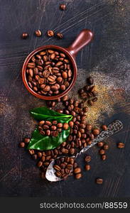 coffee beans and green leaf on a table