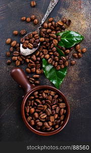 coffee beans and green leaf on a table