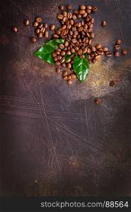 coffee beans and green leaf on a table