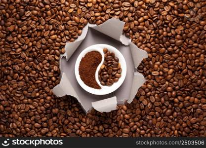Coffee beans and grey torn package paper. Coffee bean backround with copy space