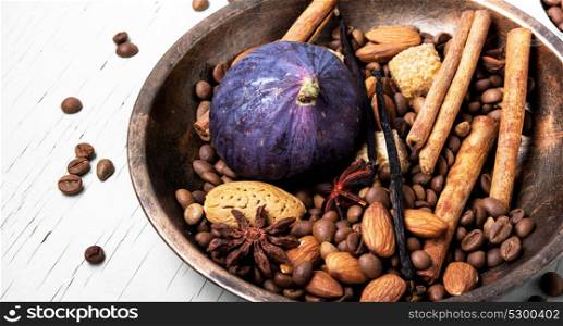 coffee beans and mix spices. roasted coffee beans in bowl with anise, cinnamon and almonds