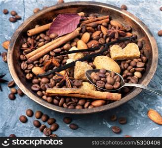 coffee beans and mix spices. roasted coffee beans in bowl with anise, cinnamon and almonds