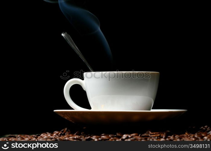 coffee beans and white hot cup of drink