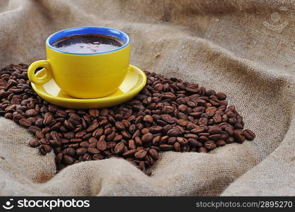 coffee beans and yellow cup