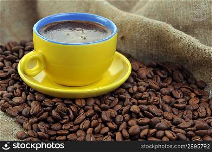 coffee beans and yellow cup