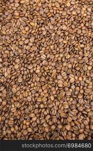 Coffee beans as a background texture in view