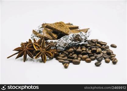 coffee beans chocolate pieces white background