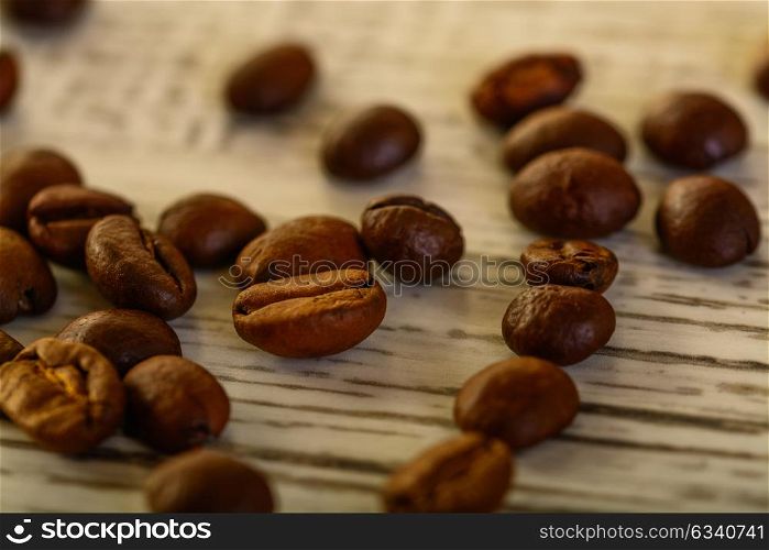 coffee beans close up on whithe wood background