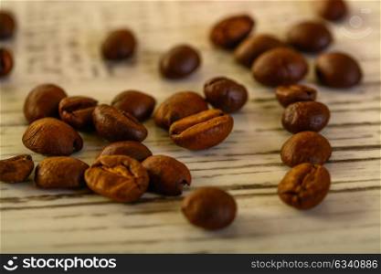 coffee beans close up on whithe wood background