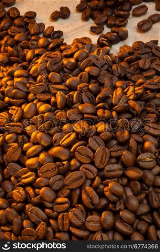 Coffee Beans - Coffee is a brewed beverage prepared from the roasted seeds of several species of an evergreen shrub of the genus Coffea.