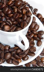 Coffee beans in a cup - focus in the first plane -