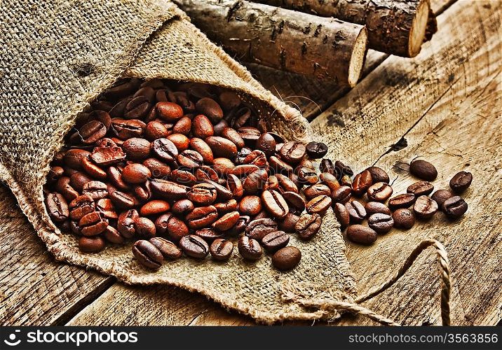 coffee beans in bag on a old wooden background