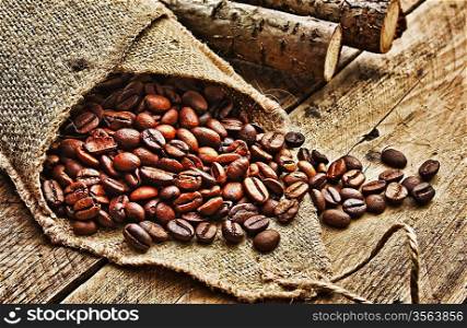 coffee beans in bag on a old wooden background