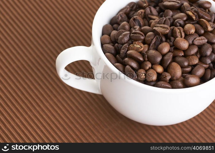 Coffee beans in cup