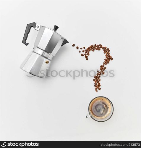 Coffee beans in the shape of question marks, a cup of strong coffee and a metal coffee maker on a gray background with space for text. Flat lay. A cup of coffee, metal coffee maker and coffee beans in the shape of a question mark on a gray background with space for text. Flat lay