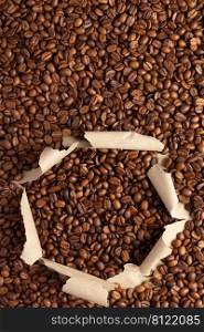 Coffee beans in torn package paper. Coffee bean backround with copy space