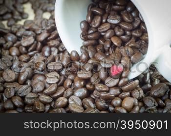 Coffee beans in white mug and background with clipping path of heart shape, easy to change or adjust heart shape color.&#xA;
