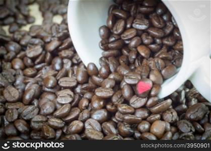 Coffee beans in white mug and background with clipping path of heart shape, easy to change or adjust heart shape color.&#xA;