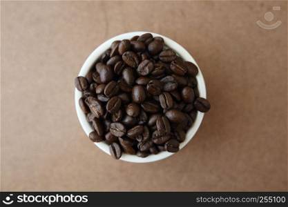 Coffee beans isolated in wood background