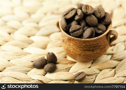 coffee beans lying in a small jug
