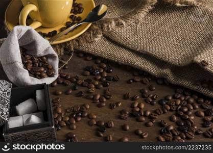 coffee beans near sack tea set box sugar sackcloth