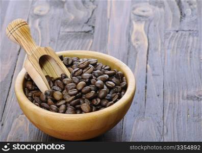 Coffee beans of the highest quality on the wooden table.