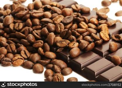 coffee beans on a chocolate bar. a lot of coffee beans on a plain chocolate bar