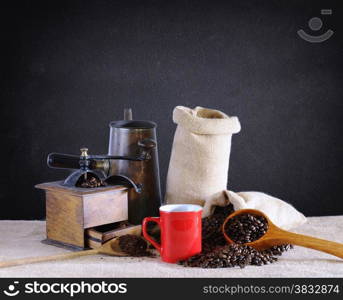 Coffee beans on a table with blackboard.