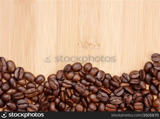 Coffee beans on a wooden background