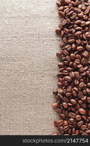Coffee beans on burlap background with copyspace. Coffee beans on burlap background
