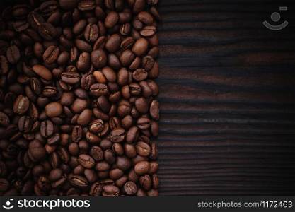 Coffee beans on dark wood background. Coffee beans on wood background