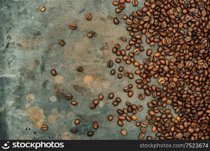 Coffee beans on grunge metal background. Vintage style toned picture