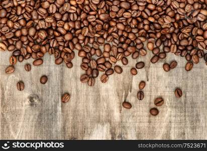 Coffee beans on rustic wooden background