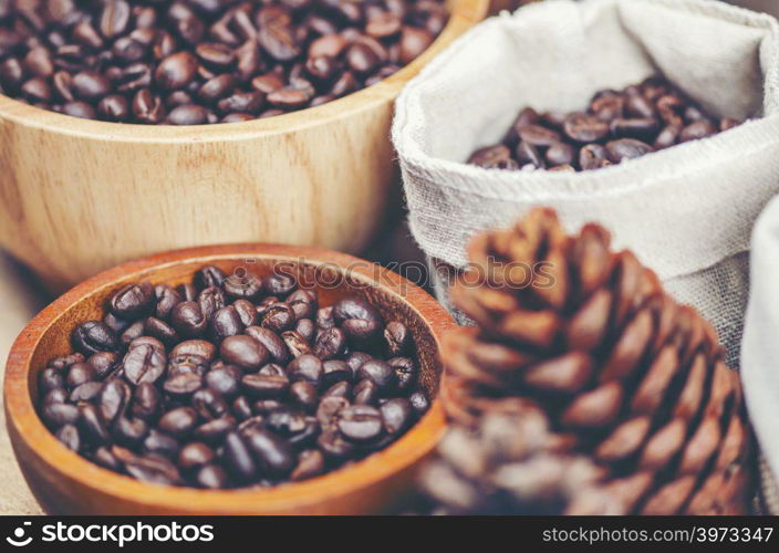 coffee beans on wooden background, arabica coffee, vintage filter image