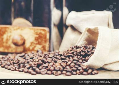 coffee beans on wooden background, arabica coffee, vintage filter image