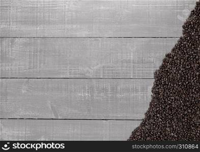 Coffee beans on wooden background texture