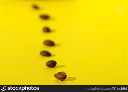 coffee beans on yellow background
