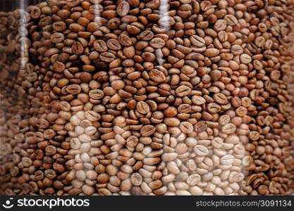 coffee beans pattern. roasted coffee beans in glass jar. coffee beans background. endless coffee texture. seamless background.. coffee beans pattern. roasted coffee beans in glass jar. coffee beans background. endless coffee texture. seamless background