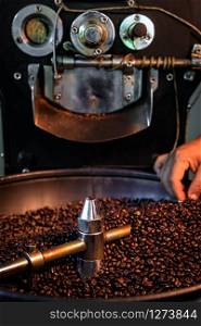 coffee beans process spin machine roasted tank selective focus detail coffee beans