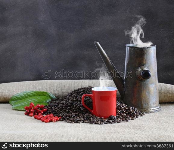 Coffee beans with blackboard on a table.